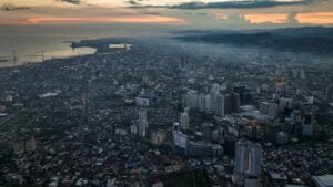 A City in Recovery - An aerial view of Cebu City at dusk, showcasing the resilient spirit and determination of its people as they rebuild and recover from the devastation of Supertyphoon Odette.