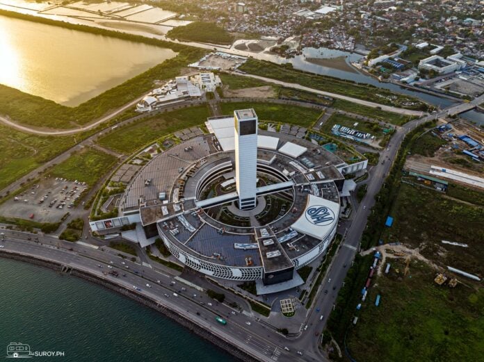 Aerial Perspective: An aerial view of SM Seaside City Cebu showcases its impressive size and unique circular design.