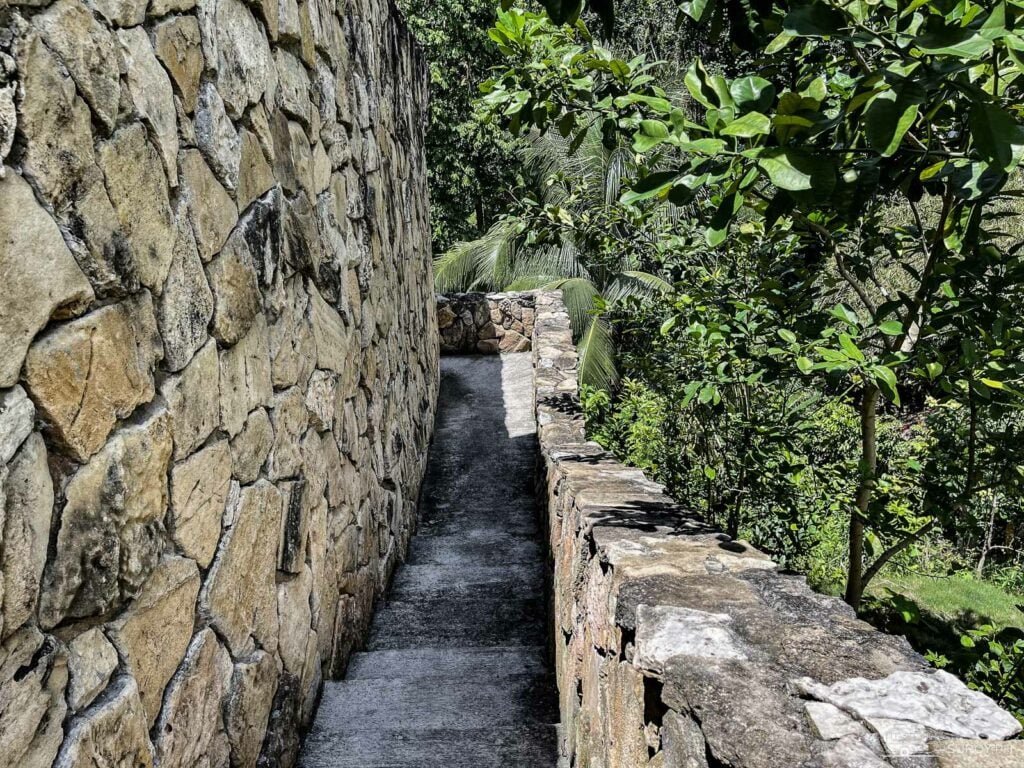 The paved stairs head down the falls. The falls are around a 3-minute walk from the garage. 