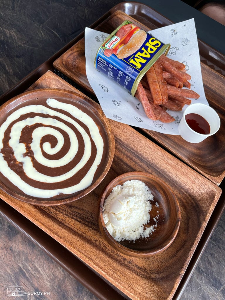 Indulge in Charlie’s Cup’s unique dishes like the creamy champorado and crispy Spam fries, perfect for any time of day.