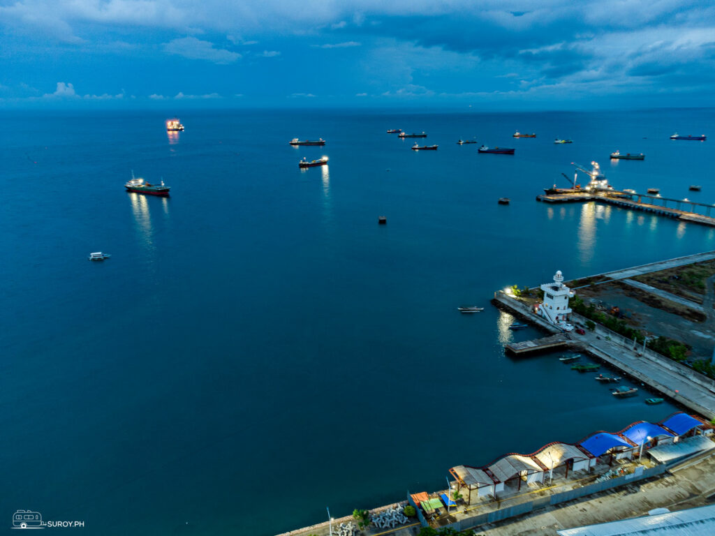 The lighthouse in Naga City with ships parking at the bay waiting for its turn to dock in Cebu. 