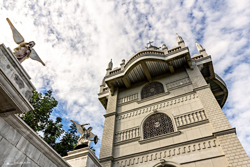 The grand facade where a huge towering structure is guarded by angels in the entrance of Simala Shrine.