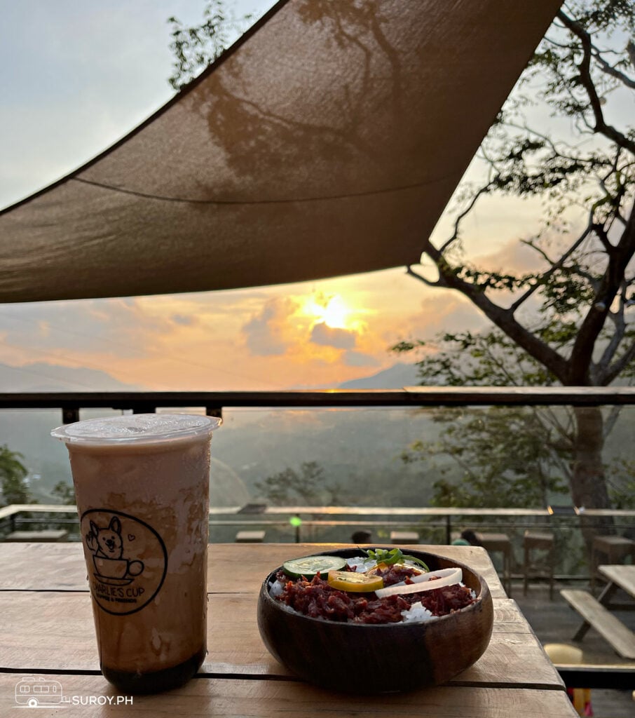 Enjoying a serene sunset at Charlie’s Cup with a refreshing drink and a delicious meal – a perfect end to a perfect day.