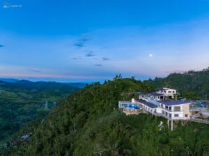 Aerial View of Serenity Farm and Resort: An aerial view showcasing the luxurious Serenity Farm and Resort nestled in the lush hills of Busay.