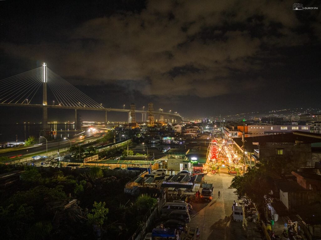 A view of the Carbon Night Market and a view of the iconic CCLEX bridge.