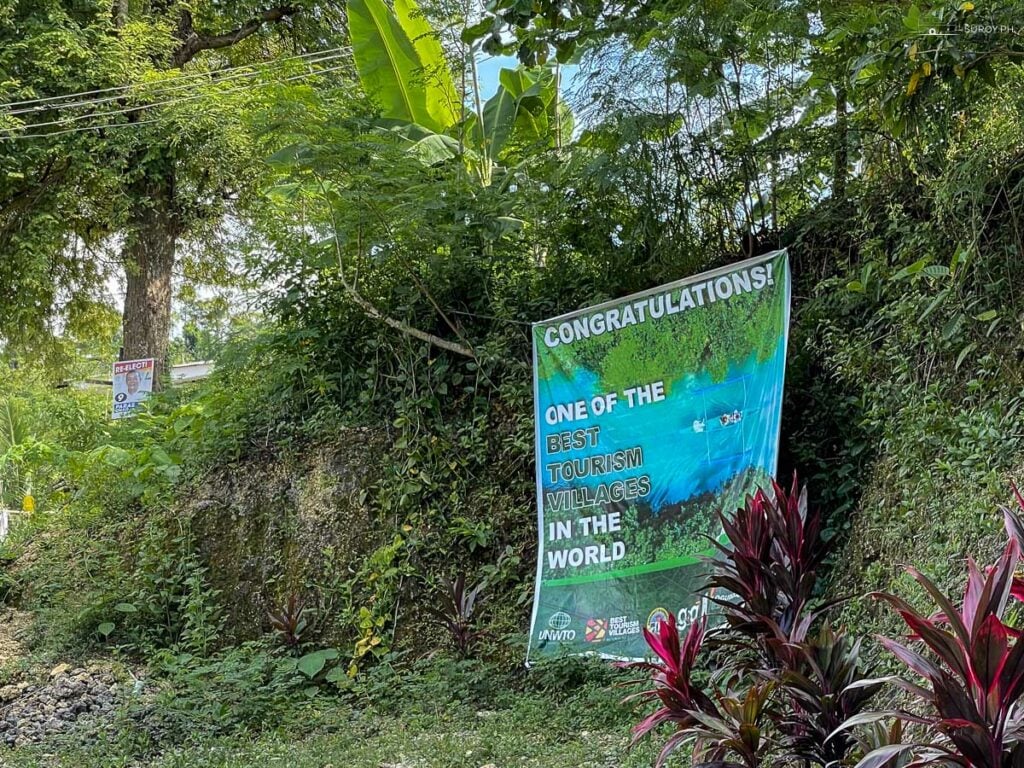 A congratulatory banner celebrating Bojo River’s recognition as one of the best tourism villages in the world.