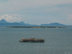 Lakawon Island Resort from Afar - A breathtaking view of Lakawon Island, Bacolod's tropical paradise, with the TawHai Floating Bar in the foreground, showcasing the island’s idyllic beauty.