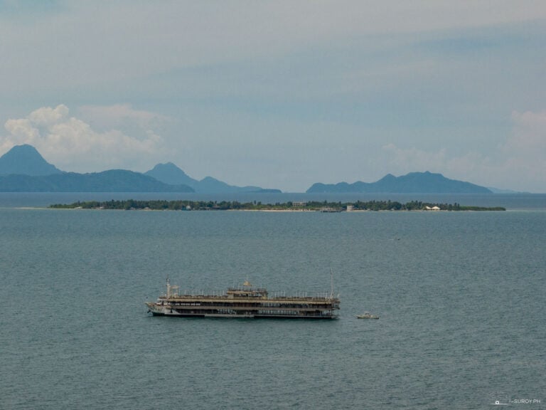 Lakawon Island Resort from Afar - A breathtaking view of Lakawon Island, Bacolod's tropical paradise, with the TawHai Floating Bar in the foreground, showcasing the island’s idyllic beauty.