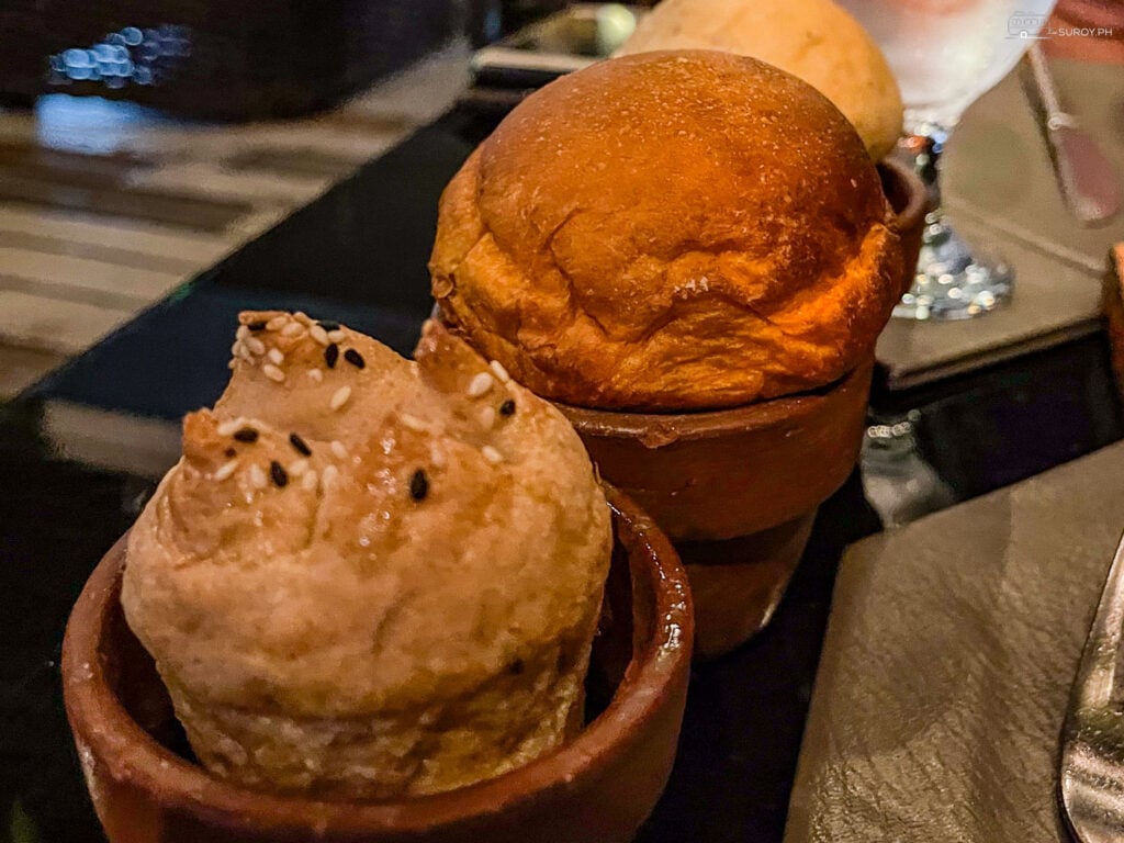 Bread Service: Delight in the freshly baked bread served with an array of delicious dips, setting the tone for a memorable meal.