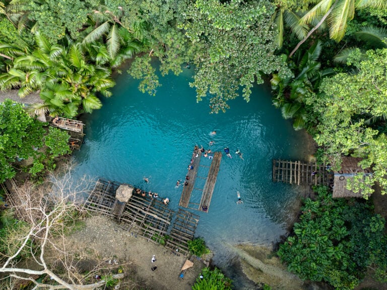 Aerial View of Bliss - An aerial view of the stunning Tuburan Blue Hole Spring. The perfect spot for a day of fun and relaxation.