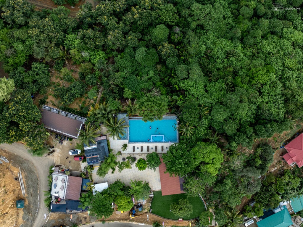 An aerial view of Mabini Skyview Resort, highlighting the stunning infinity pool and lush surroundings.