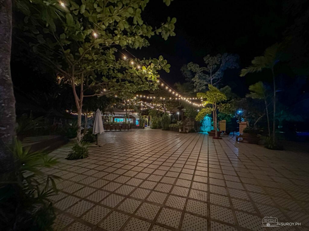 The resort grounds come alive with lights, creating a serene nighttime atmosphere.