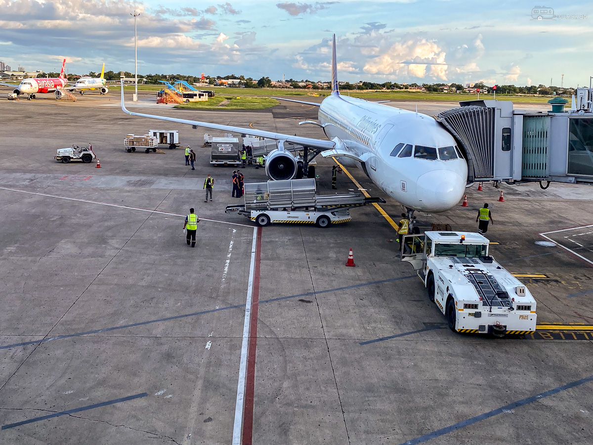 Aircraft being prepared at an airport gate before departure