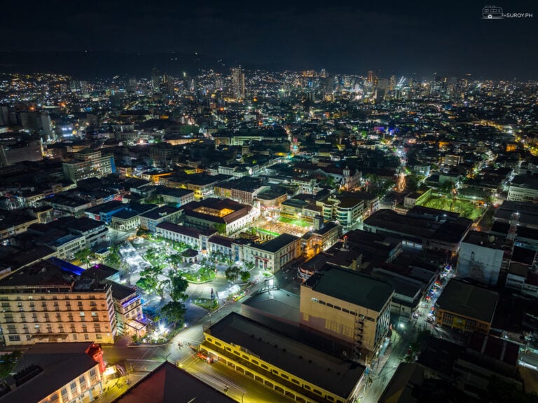 Under the night sky, Cebu City sparkles with life, encapsulating the vibrant spirit of a metropolis where history and modernity intertwine seamlessly. A testament to its rich heritage, Magellan’s Cross stands illuminated, guiding the city’s timeless journey.