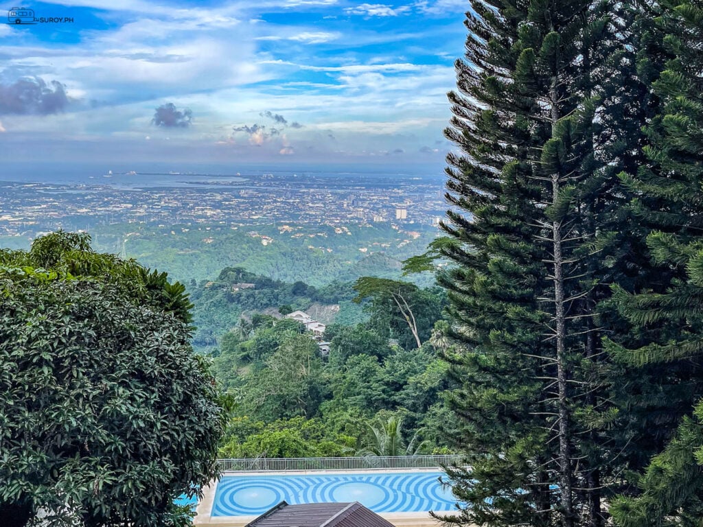 The swimming pool offers a stunning backdrop of nature, perfect for a relaxing swim.