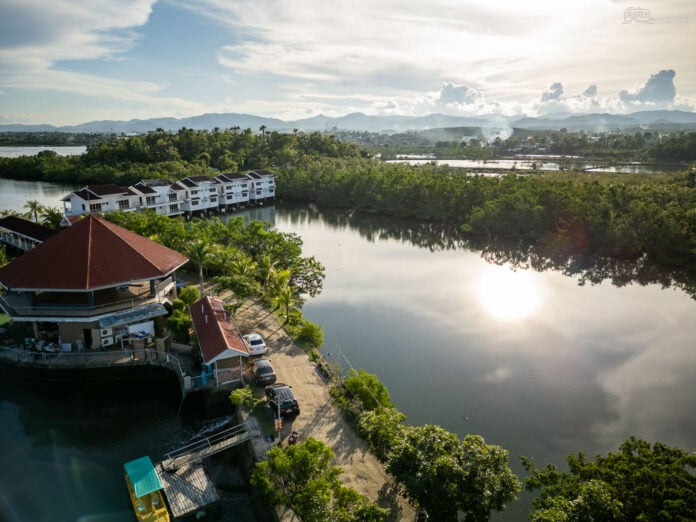 An aerial view of Papakits Marina and Fishing Lagoon in Liloan showcasing its beautiful landscape and serene waters.