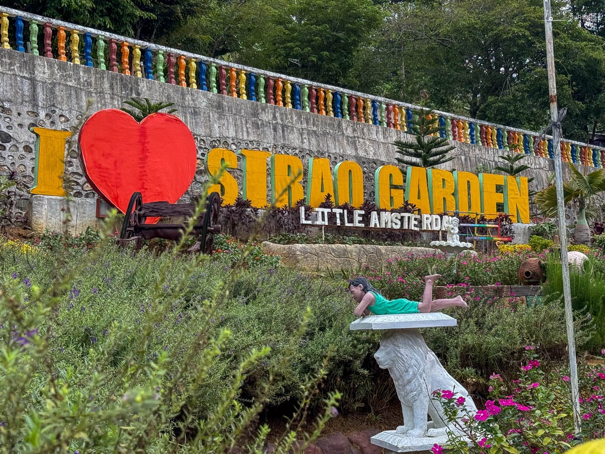 The I love Sirao Garden sign and the windmill structure at the top of the hill.