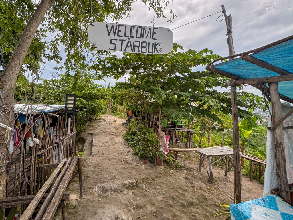 The quaint welcome sign at the entrance of Starbuk’s Kapehan, inviting visitors to relax and enjoy.