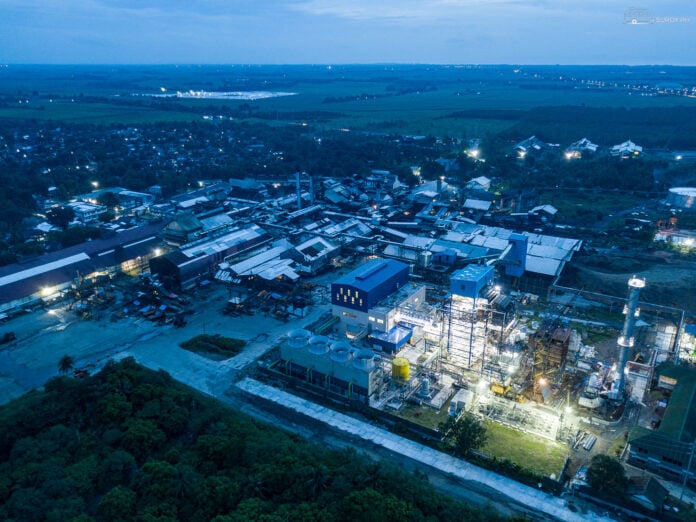 An aerial view of the bustling Victorias Milling Corporation at dusk.