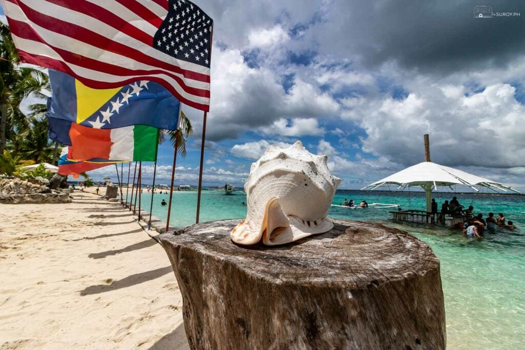A piece of paradise: Flags fluttering in the sea breeze at Virgin Island.