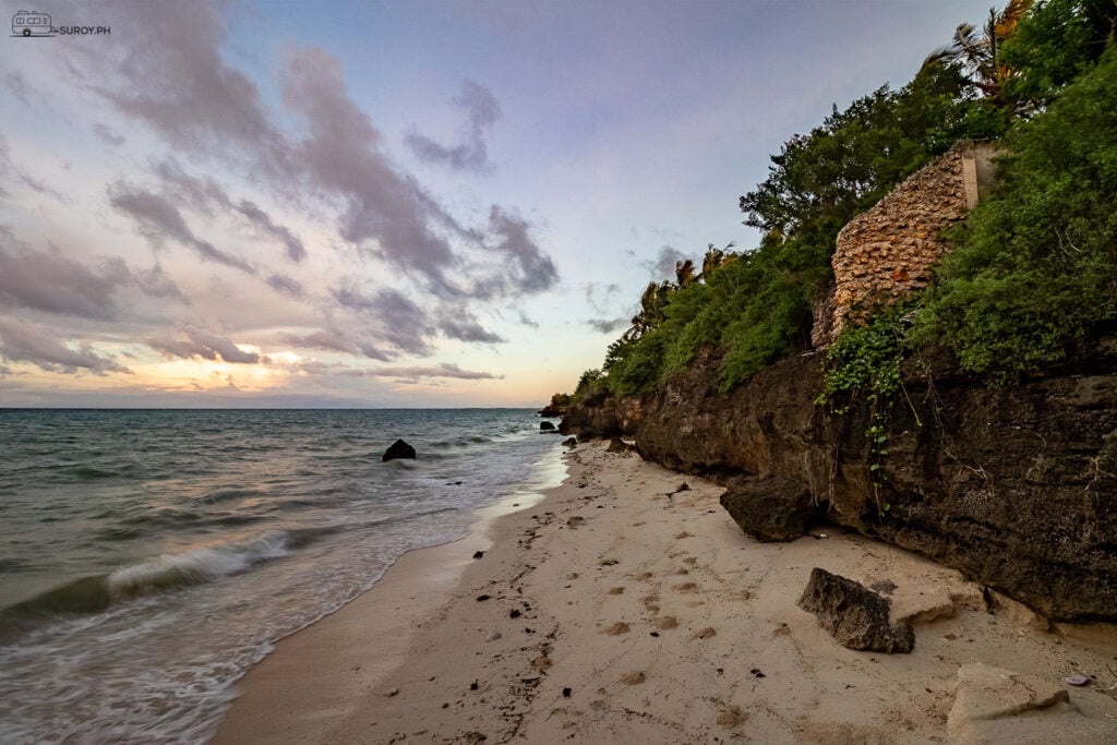 The serene beauty of Bantayan Island’s rocky shore at dusk.