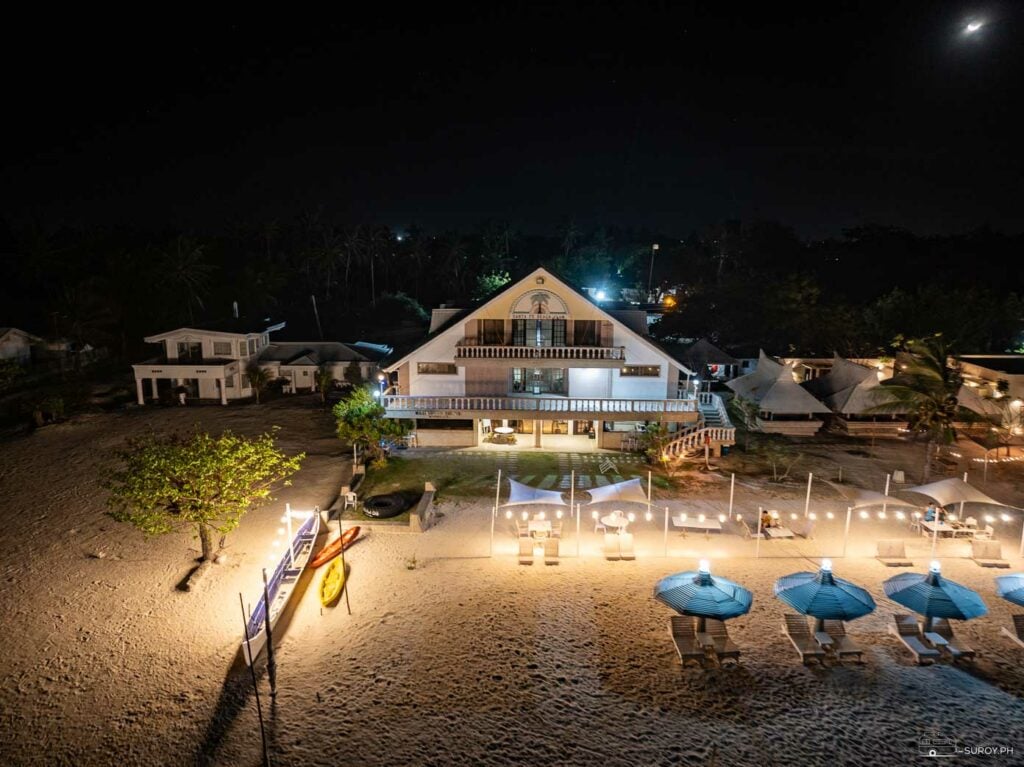 Sta. Fe Beach Resort under a moonlit sky.