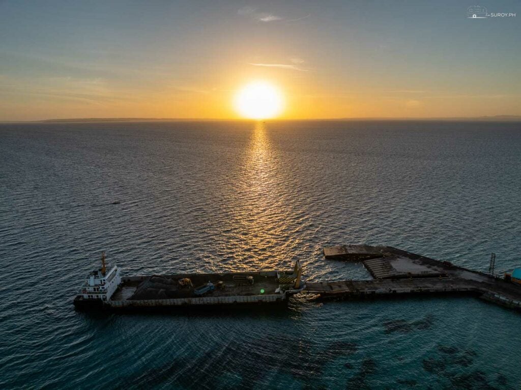 Witness the breathtaking sunset painting the horizon in the Port of Bantayan.