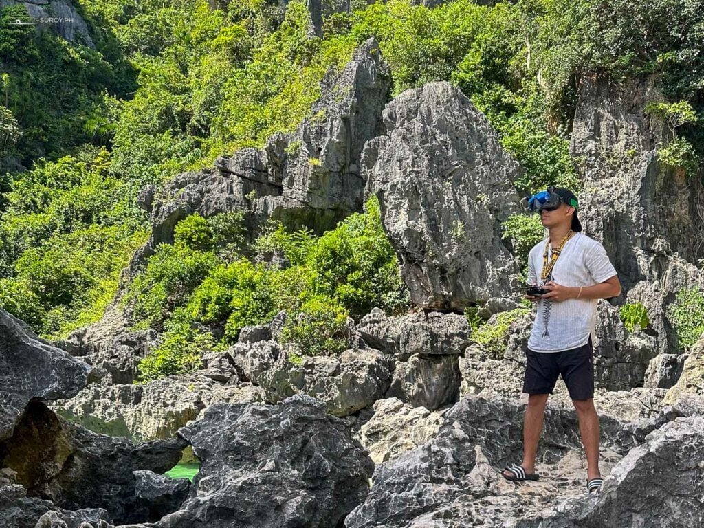 An adventurer is taking an FPV shot of Tangke Lagoon.