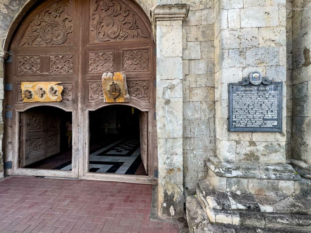 The intricately carved wooden doors of Panay Church invite visitors into its storied past.