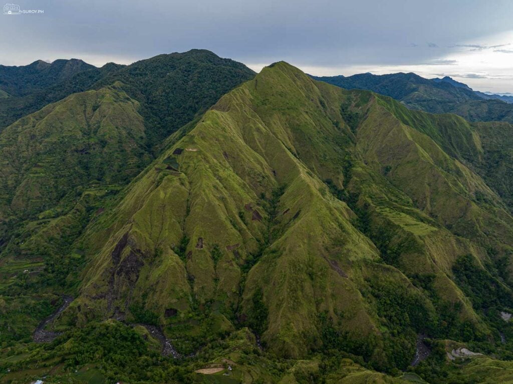 The majestic Mt. Tambara Peak as seen from Tubungan View Deck, offering panoramic views of the surrounding valleys and mountains.
