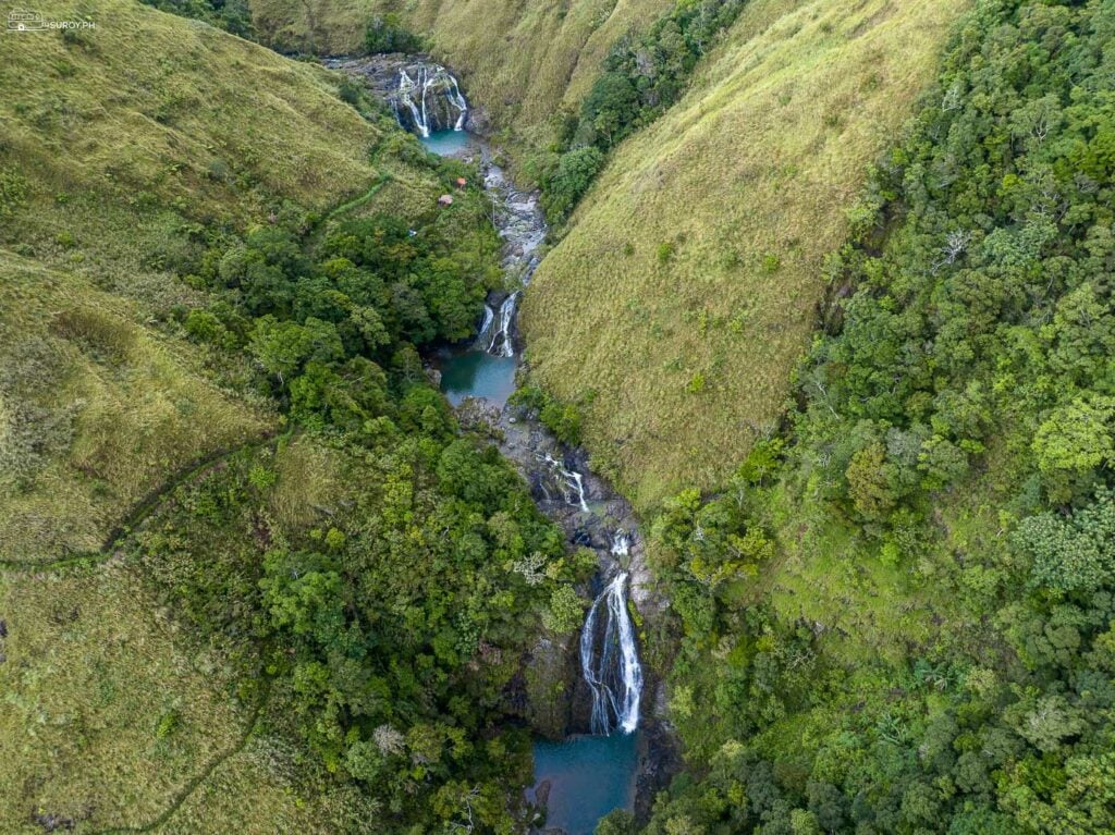 The cascading waters of Guiritsan Falls, captured in all its multi-layered glory, offer a tranquil retreat amidst nature.