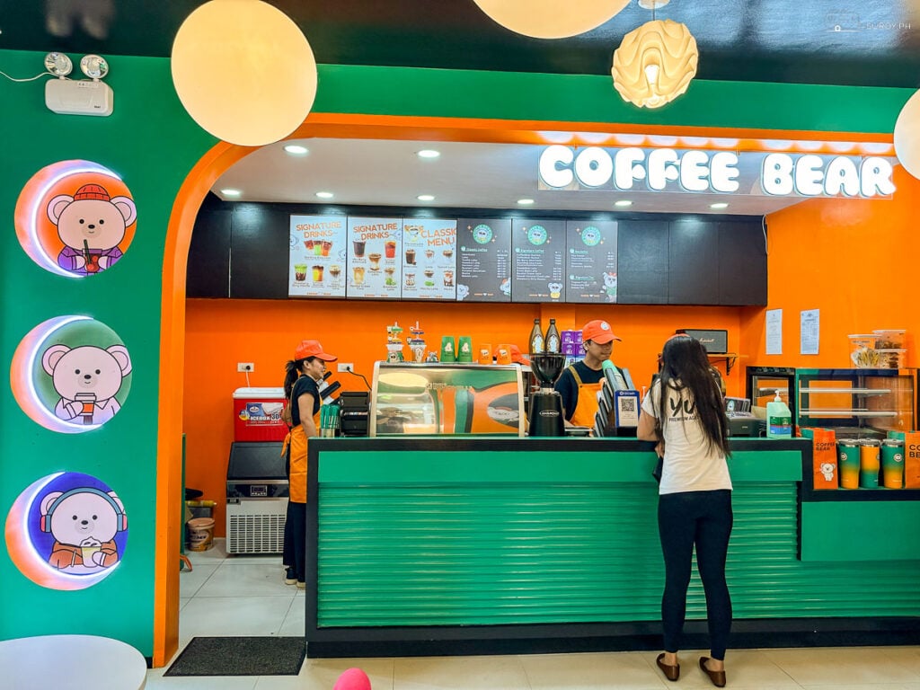 Friendly baristas at Coffee Bear is ready to serve up delicious coffee and snacks in a cheerful and vibrant setting.