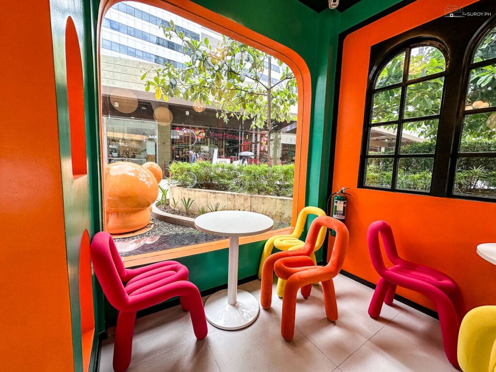 A peek inside the cozy and colorful seating area of Coffee Bear is designed for comfort and relaxation.