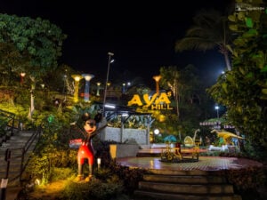 The entrance to Aya’s Hill, welcoming visitors with playful sculptures and lush gardens, sets the tone for a magical experience.