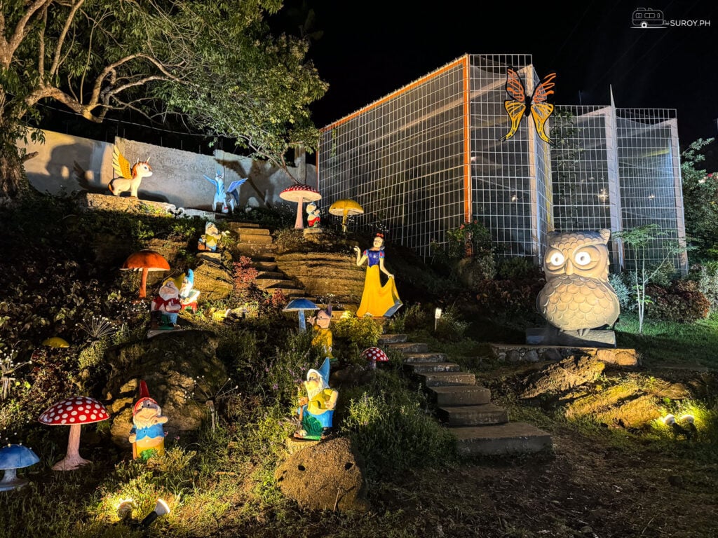 A whimsical display of fairy tale characters, including Snow White and the Seven Dwarfs, adds a playful charm to the amusement park at Aya’s Hill.