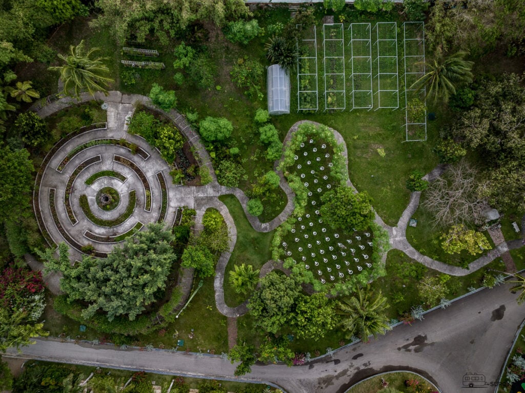 The resort’s unique garden maze and organic garden, offering a meditative and eco-friendly space for guests to explore and enjoy the lush greenery.