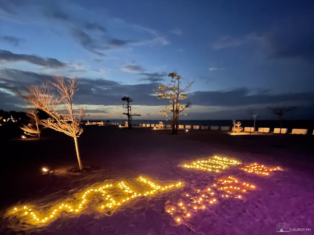 A romantic proposal is set up on the beach at Kandaya Resort, with soft lights illuminating the message “Will You Marry Me?”—creating an unforgettable moment under the stars.