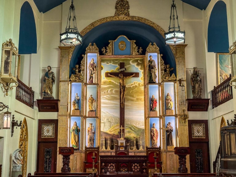 The grand altar of Capilla Santa Ana in Toledo, showcasing a striking crucifix surrounded by beautifully detailed niches of saints—highlighting the museum’s deep spiritual heritage.