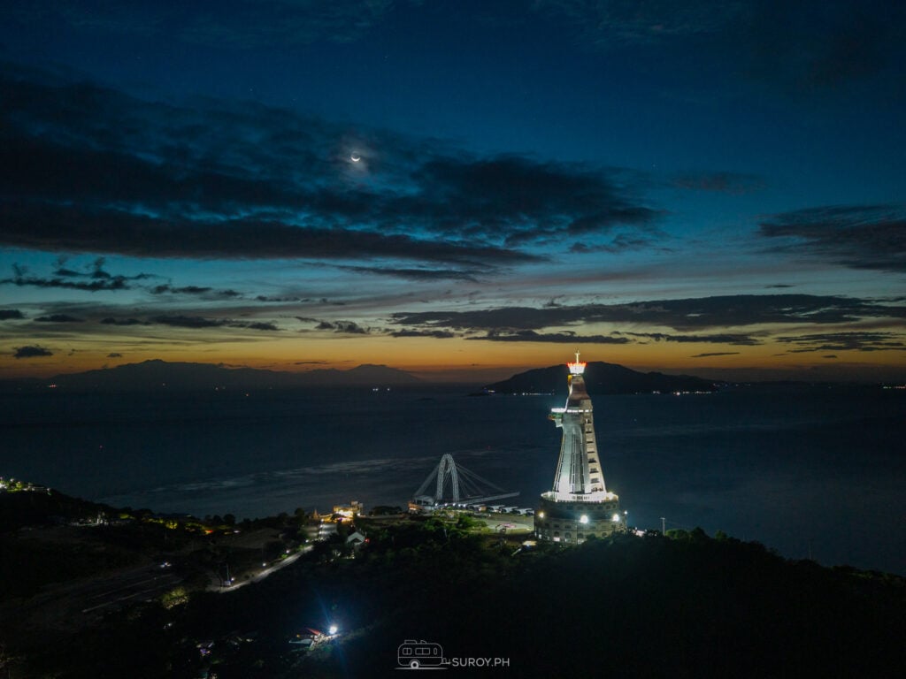 Montemaria Shrine under the night sky—where the stars, moon, and tranquil waters create a magical atmosphere of faith and wonder.