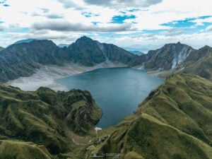 Aerial Majesty of Mt. Pinatubo – The breathtaking turquoise lake lies within the rugged volcanic walls, a mesmerizing contrast of destruction and rebirth.