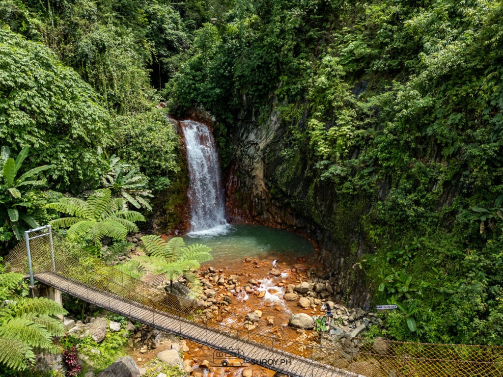 A waterfall like no other – nature’s masterpiece with fiery red rocks and cooling cascades!