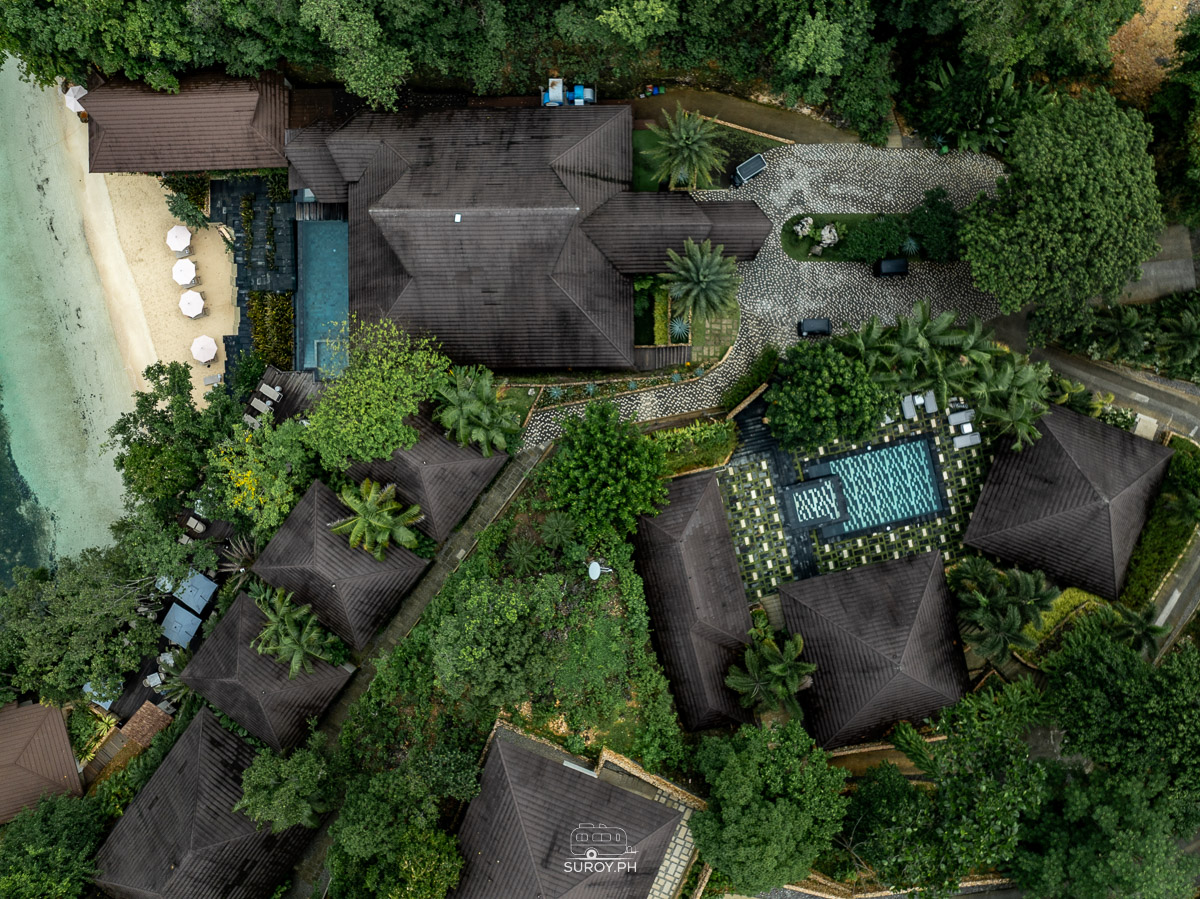 Overhead view of resort structures and pools near the beachfront at Manami Resort