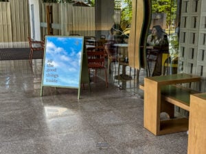 Exterior signage at Punched Coffee Cebu with the phrase “all the good things inside.