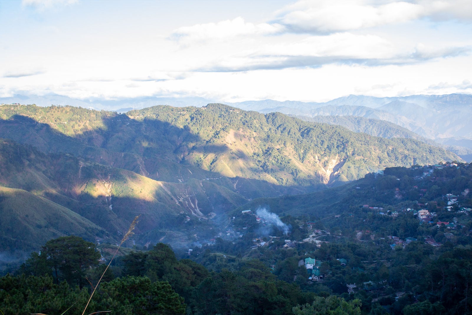Baguio city buildings spread across green Cordillera mountain slopes