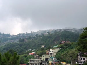 Fog settling over homes on a Baguio hillside in the Cordillera mountains