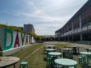 Large multicolored DAVAO letters beside an outdoor plaza