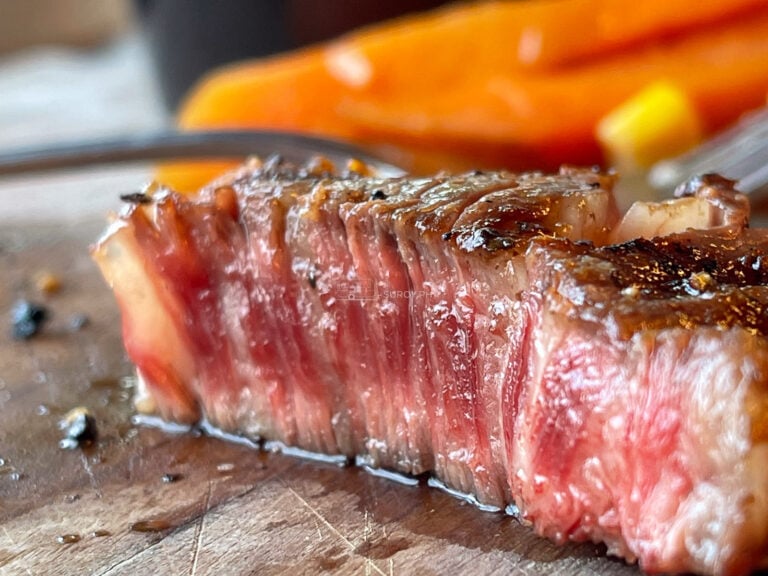 A close view of a sliced steak at Fat Jim's Cebu showing a dark crust and an even pink interior