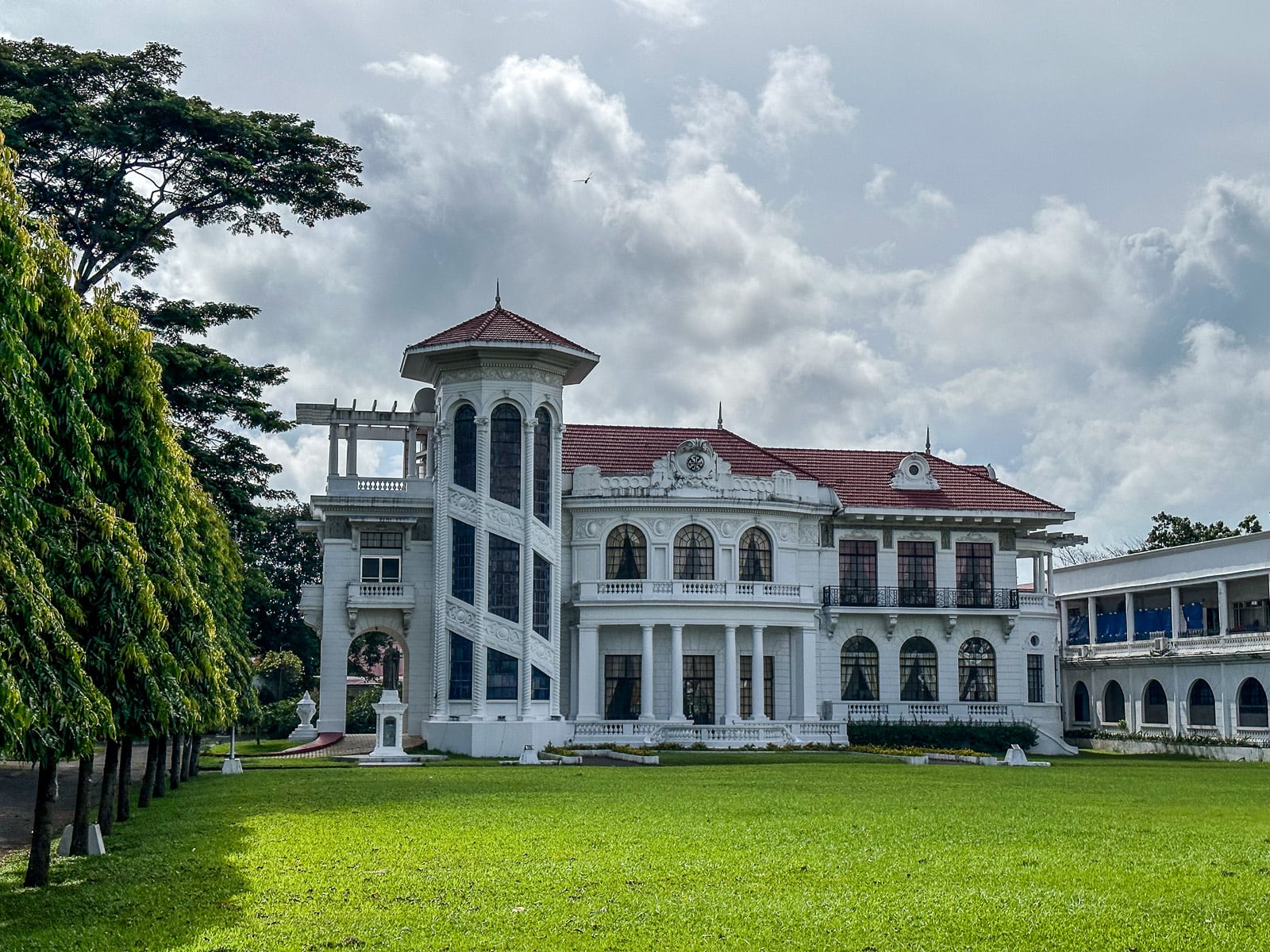 White heritage mansion surrounded by a lawn in Iloilo City