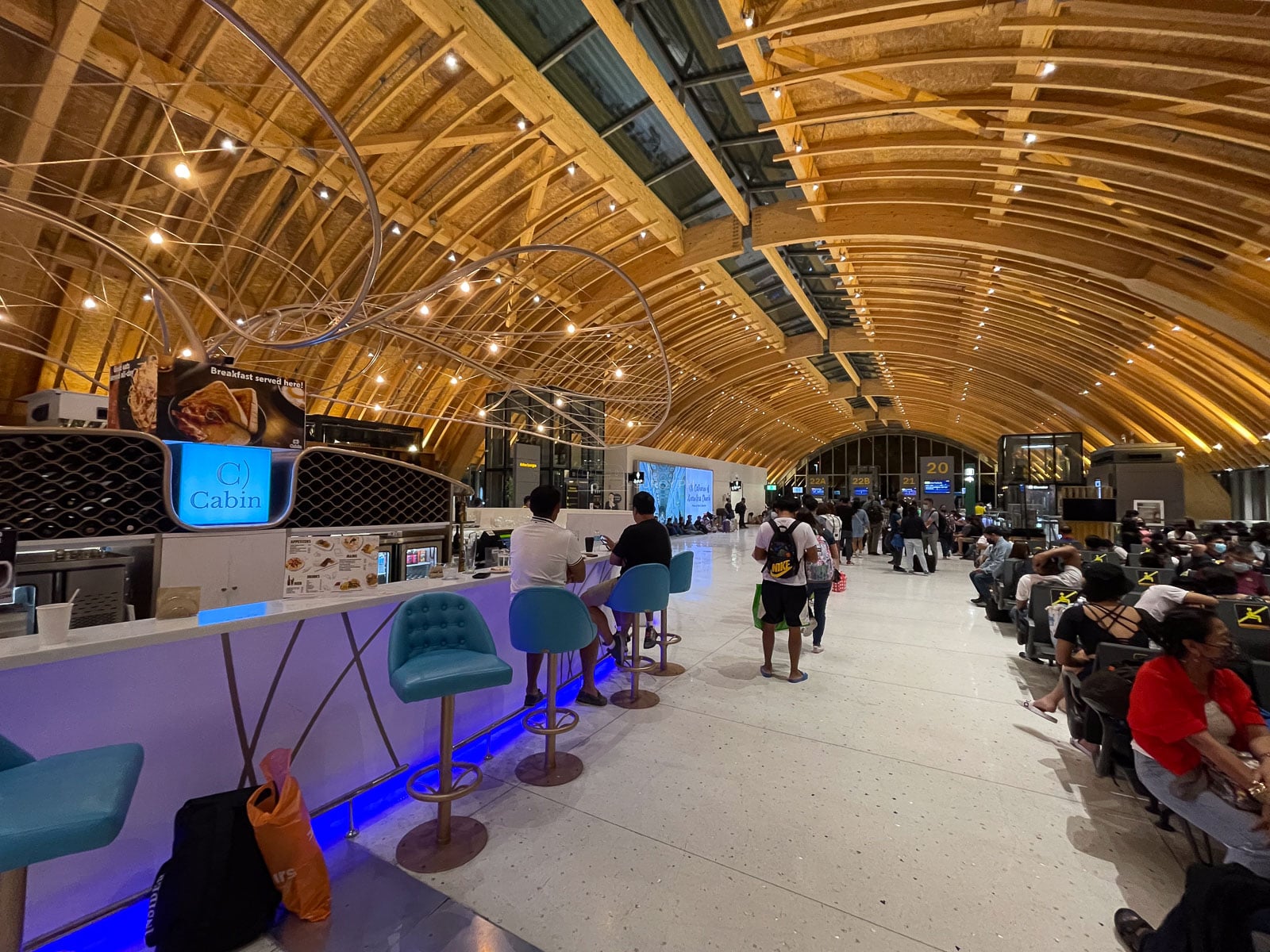 Passenger seating beneath the timber roof in Terminal 2 at Mactan-Cebu International Airport