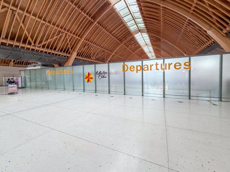 Terminal 2 departures entrance beneath the curved timber roof